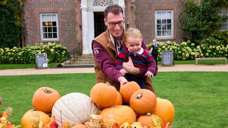 Family enjoying pumpkin displays at Hinton Ampner